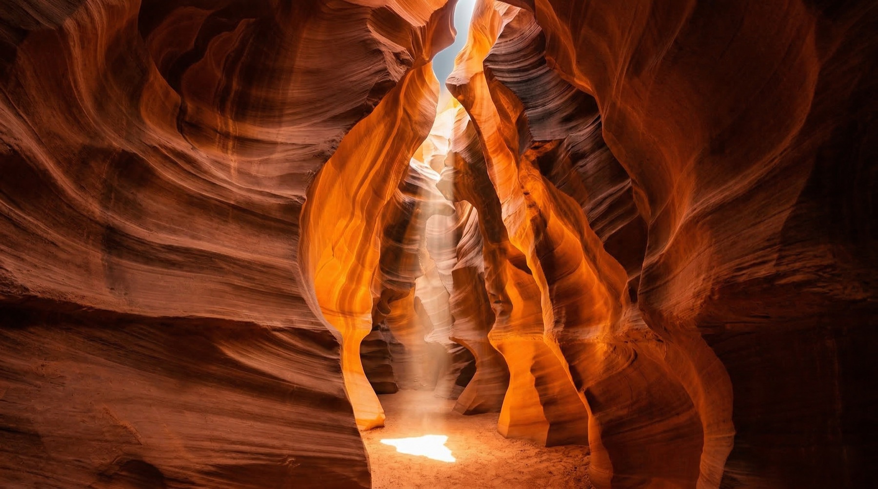 Antelope Canyon — amber canyon walls carved by light and time